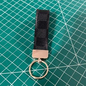 Authentic Louis Vuitton leather repurposed into a keychain.